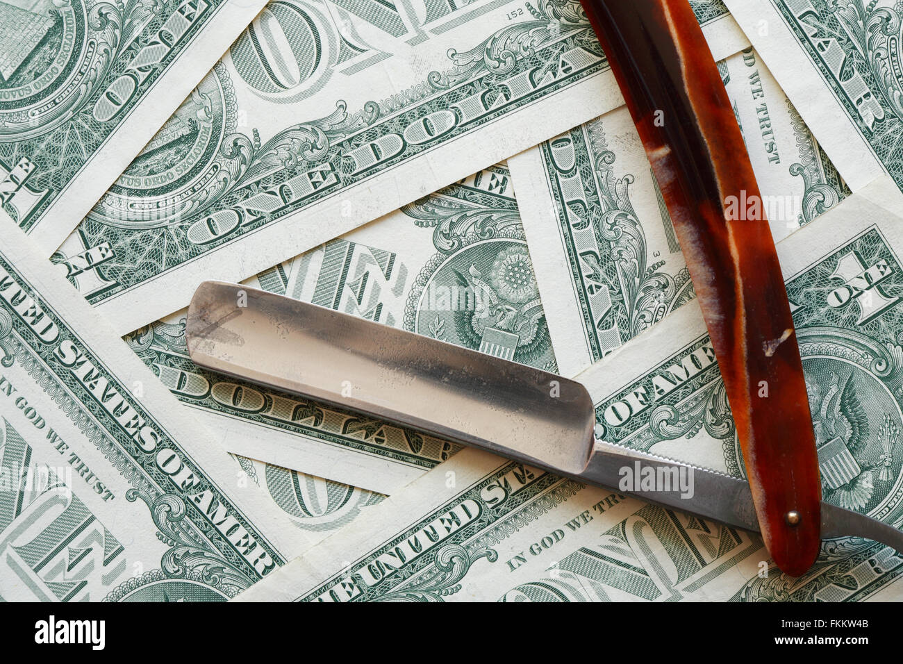 Old Money Razor Inflation concept. Old razor blade on USA cash background Stock Photo ...
