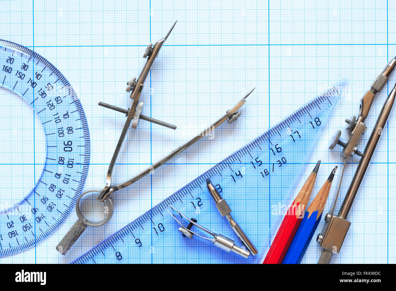 Set of drawing instrument and rulers on graph paper Stock Photo Alamy
