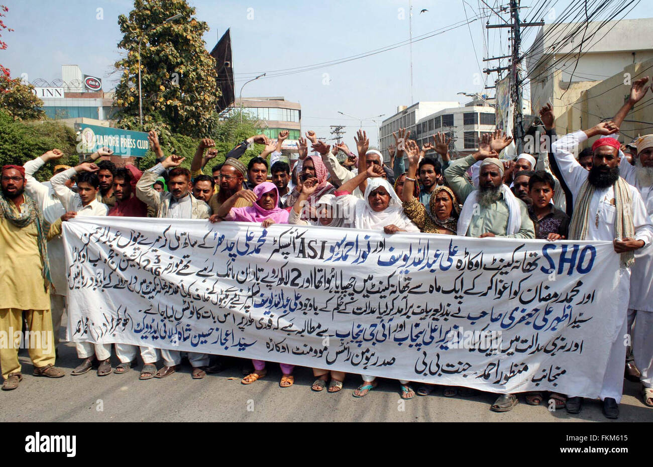 Residents of District Okara chant slogans against high handedness of police department during protest demonstration at Lahore press club on Wednesday, March 09, 2016. Stock Photo