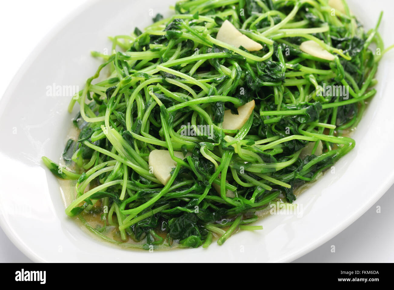 stir fried pea shoots with garlic, chinese cuisine Stock Photo