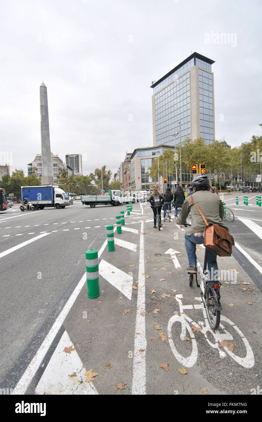 Urban cyclists. Juan Carlos I square, Diagonal avenue. Barcelona, Catalonia, Spain Stock Photo