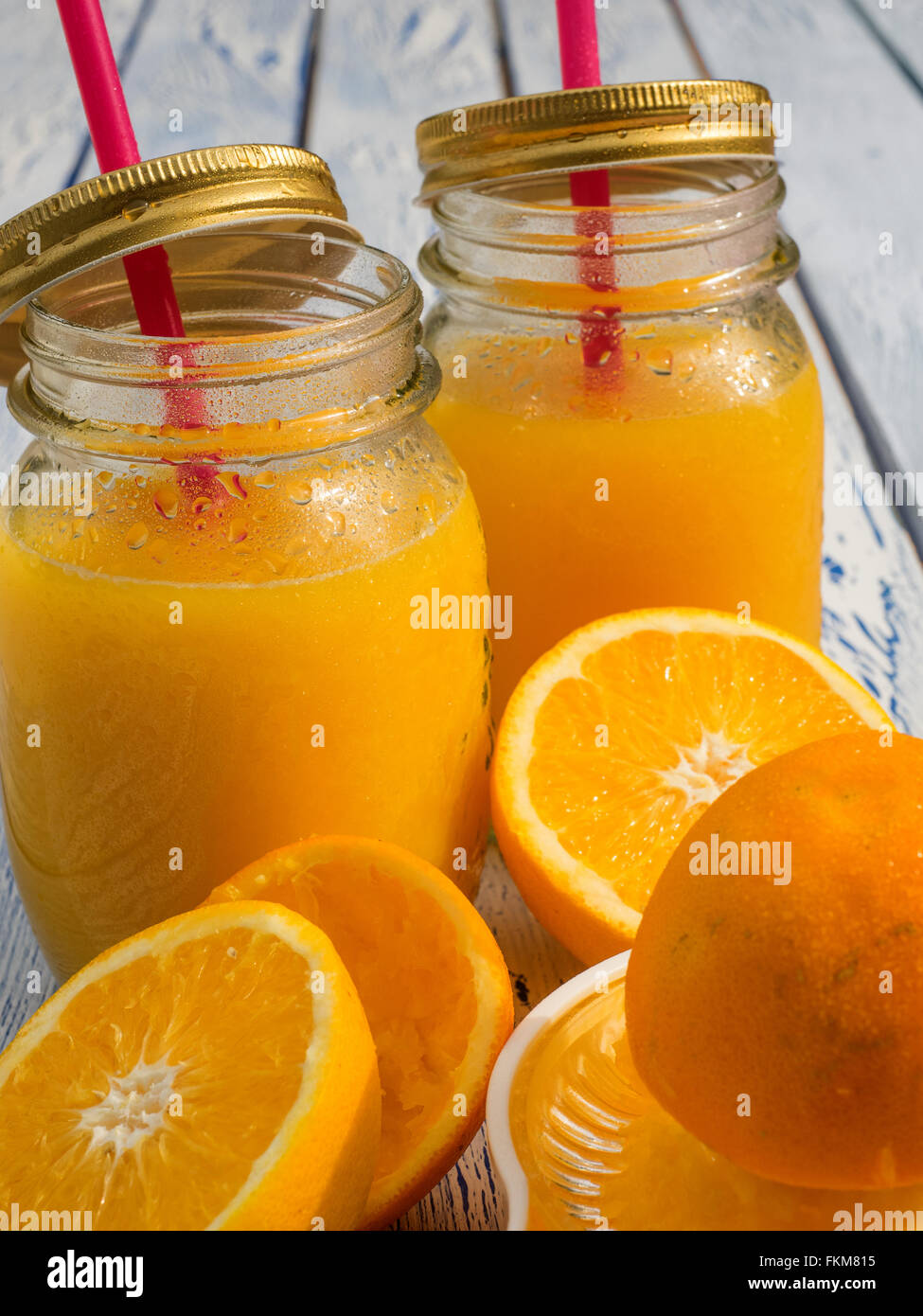 Orange juice in glass on a wooden table Stock Photo