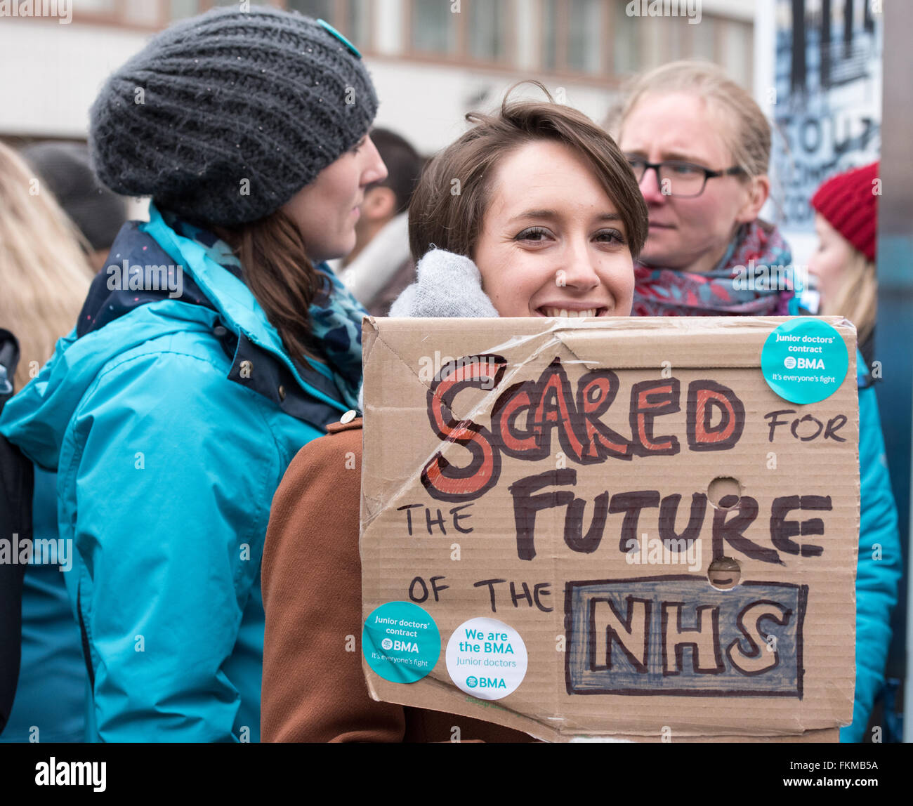 London 9th March 2016, NHS Junior Doctors picket, St Thomas Hospital, Westminster, Junior Doctor holds homemade banner Credit:  Ian Davidson/Alamy Live News Stock Photo