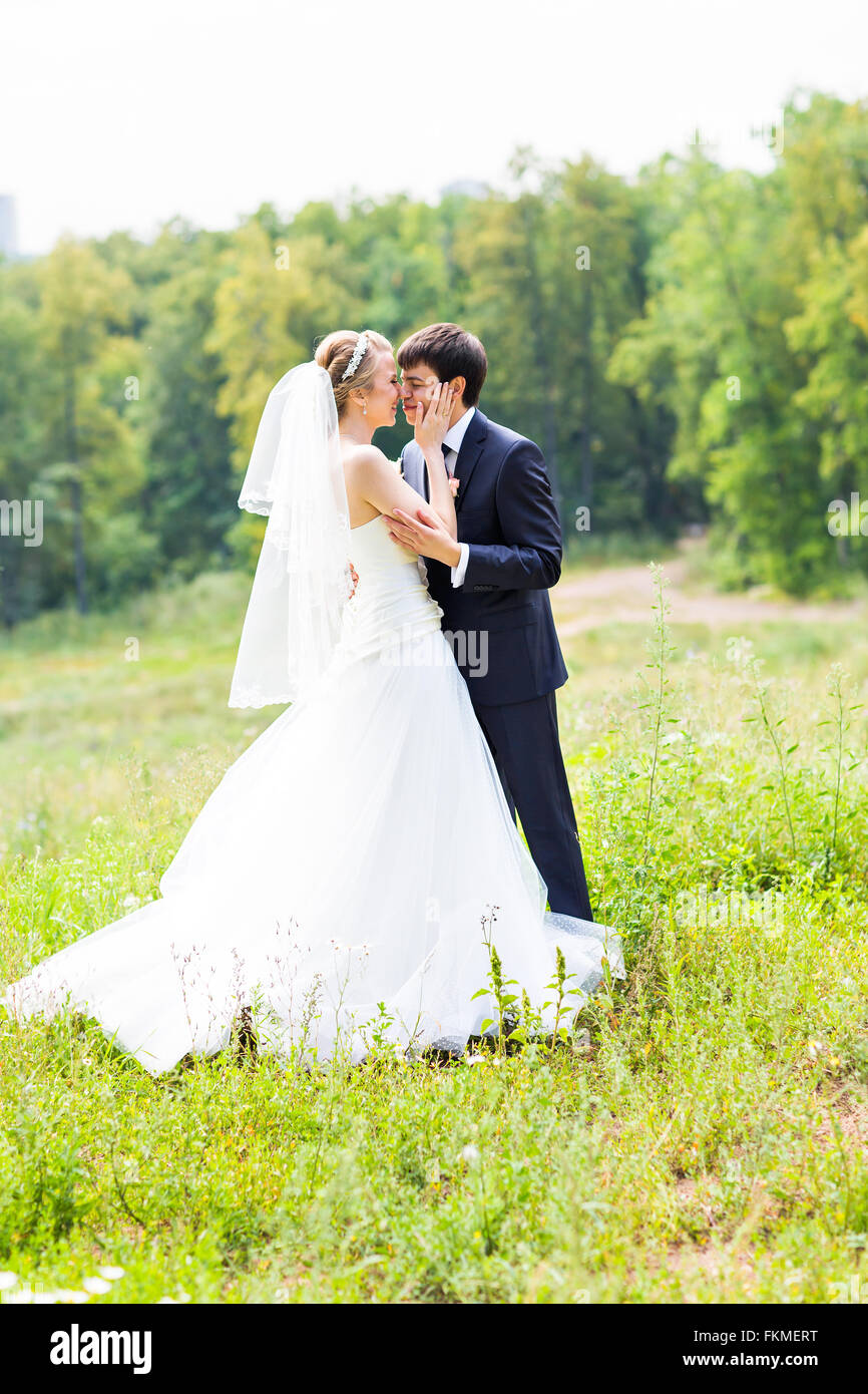 Wedding, Beautiful Romantic Bride and Groom Kissing Stock Photo - Alamy