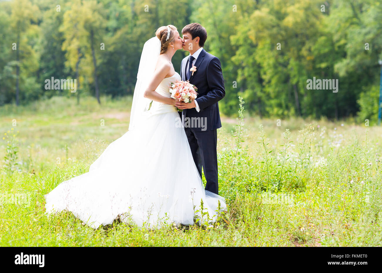 Wedding Beautiful Romantic Bride And Groom Kissing Stock Photo Alamy