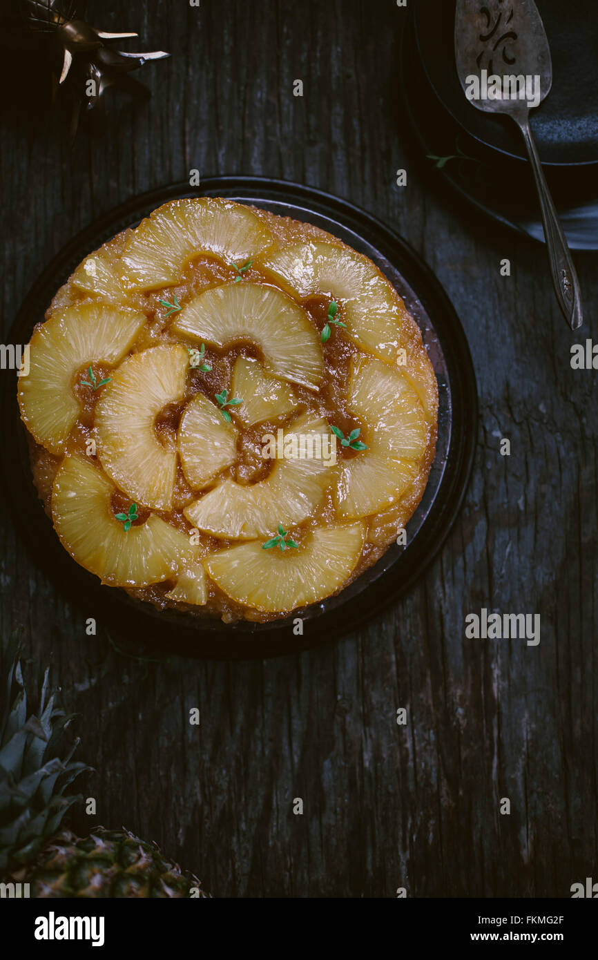 An upside down pineapple cake is photographed from the top. Stock Photo