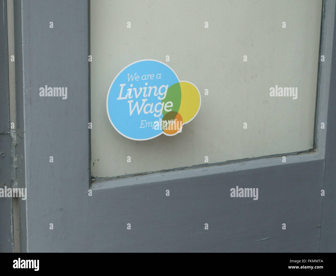 Living Wage Employer sign in Oliver Bonas shop window, Islington