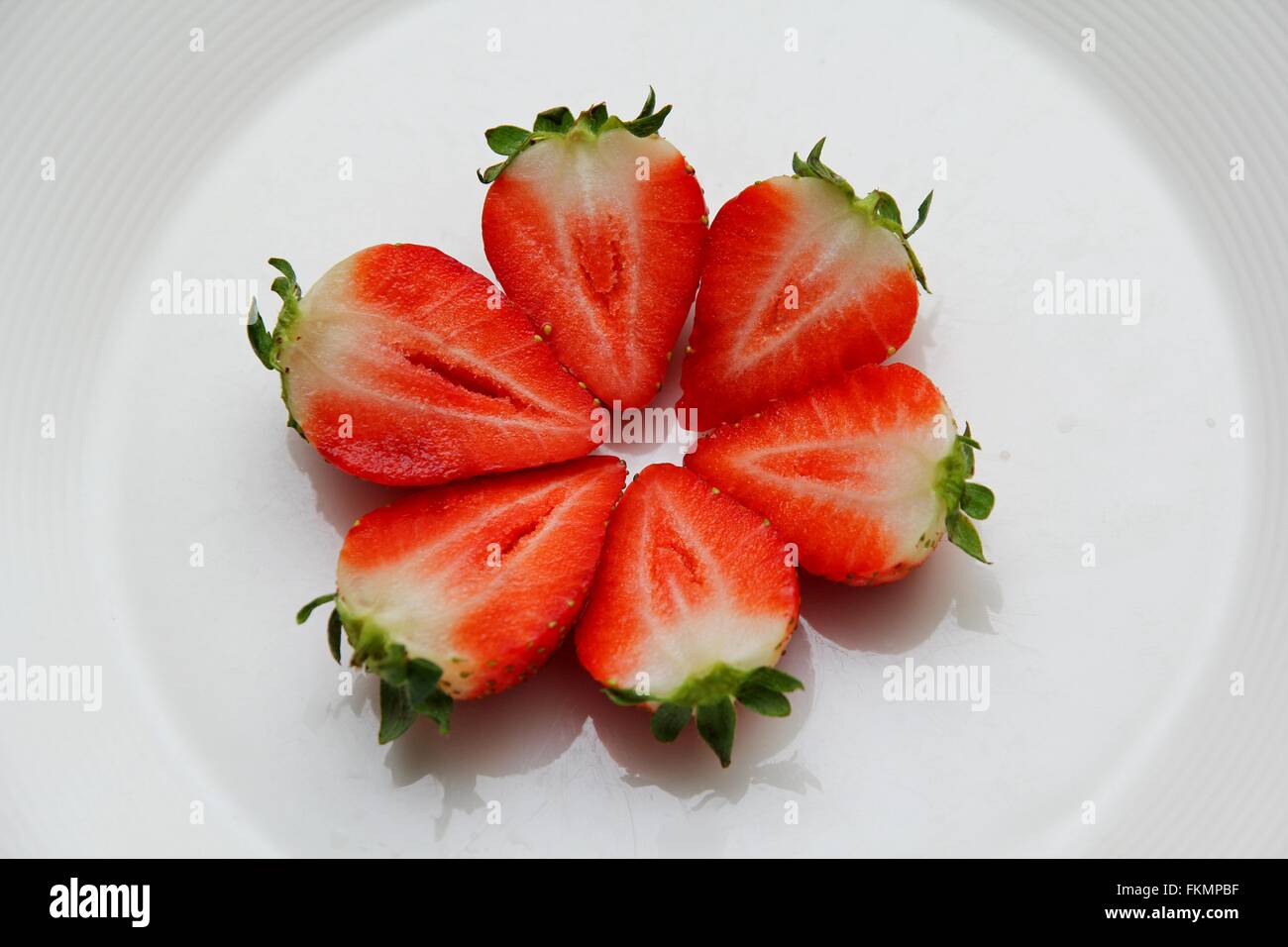 Half of strawberry isolated on white background Stock Photo