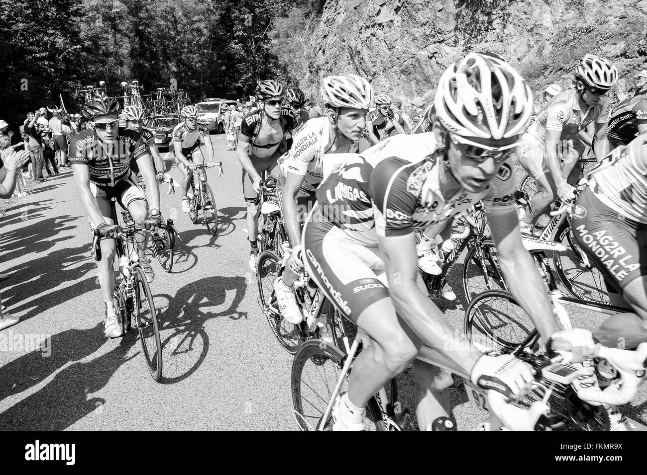 Tour de France cyclists riding up the steep mountain to Plateau de Beille, 1,780 metres. This climb is classified as a HC climb, Stock Photo