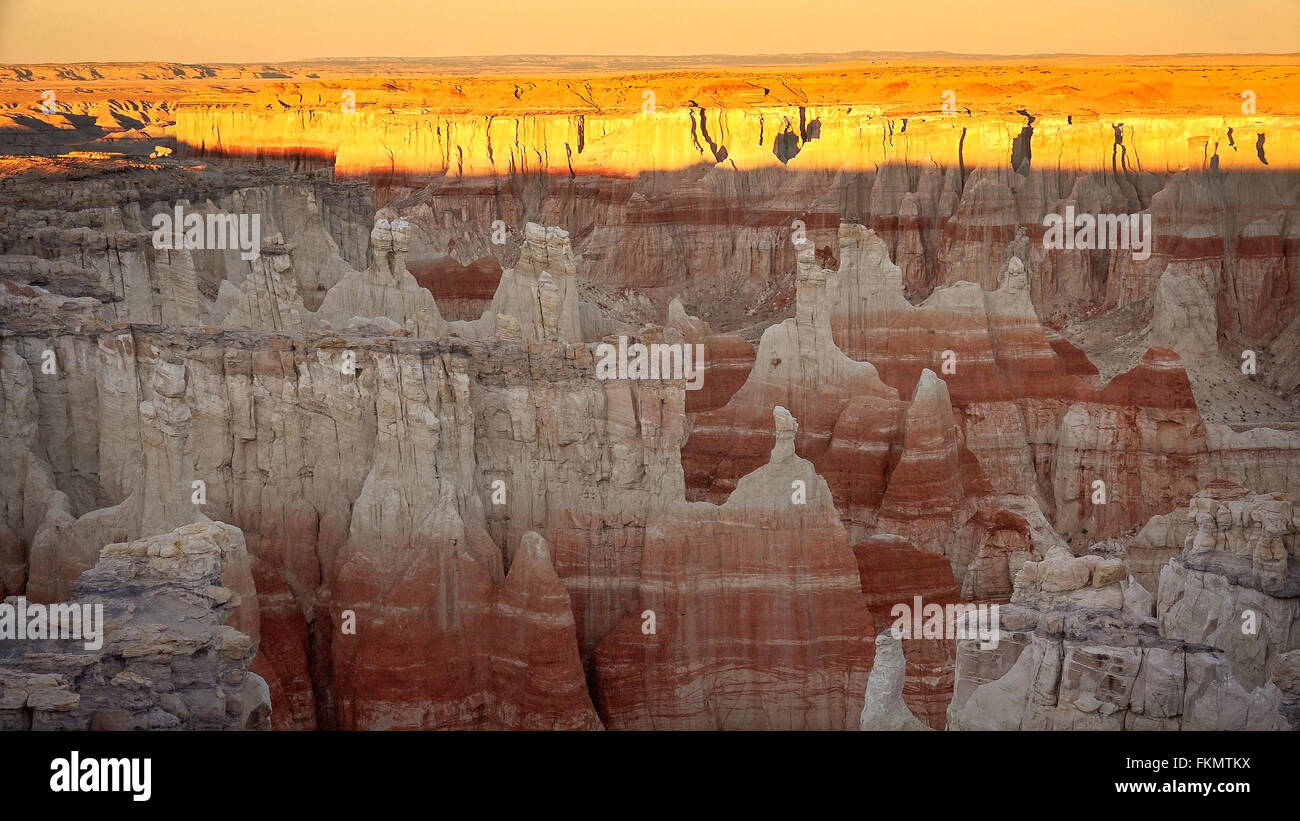 Eroding cliffs of Coal Mine Canyon at sunset near Tuba City, Arizona Stock Photo