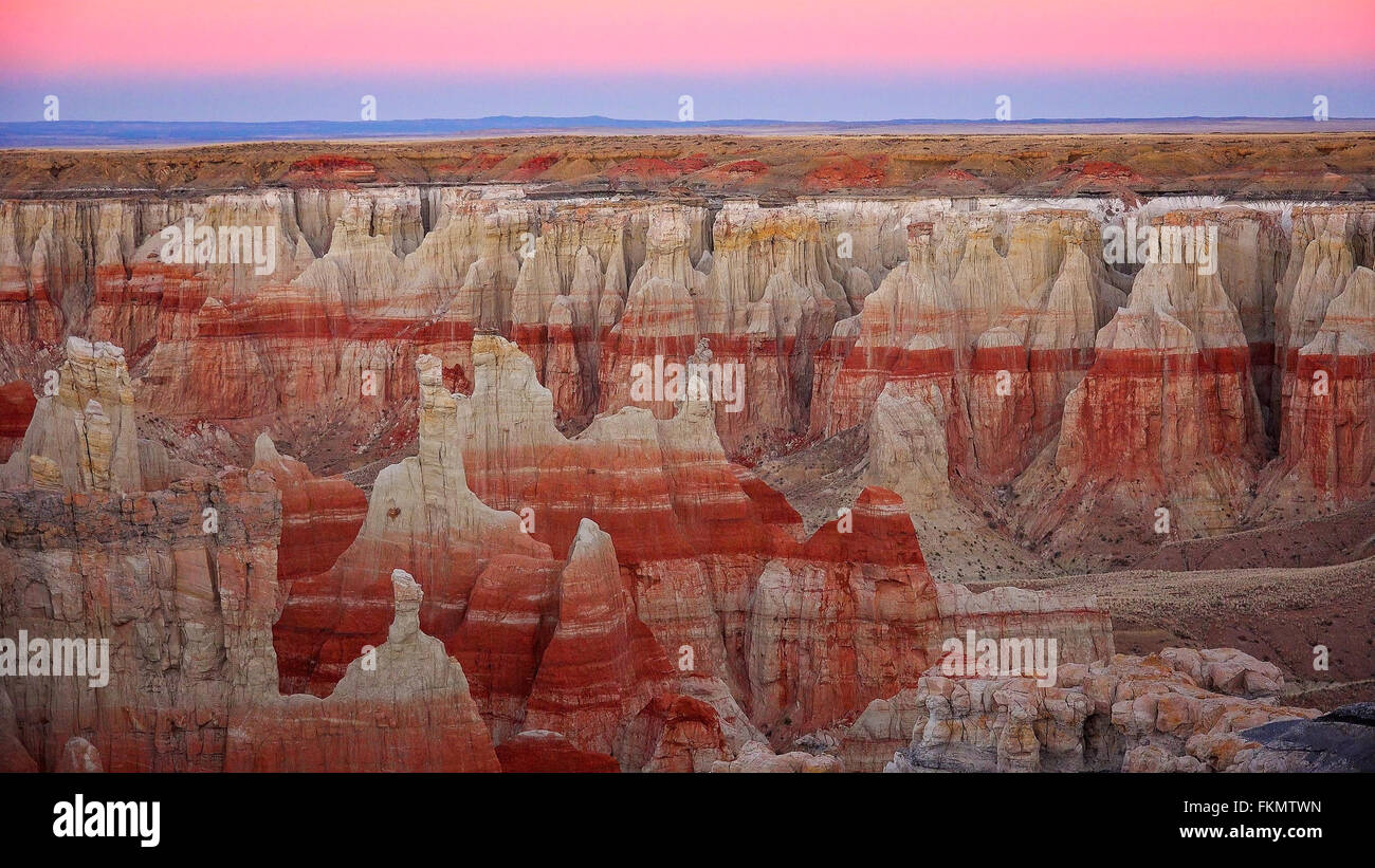 Pink light of twilight in the sky at Coal Mine Canyon in Tuba City, Arizona Stock Photo