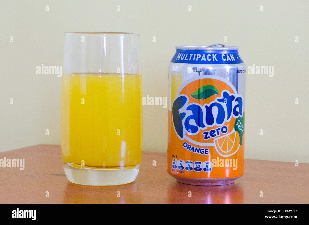 Can of Fanta Zero Orange Drink and Glass On A Table, UK Stock Photo