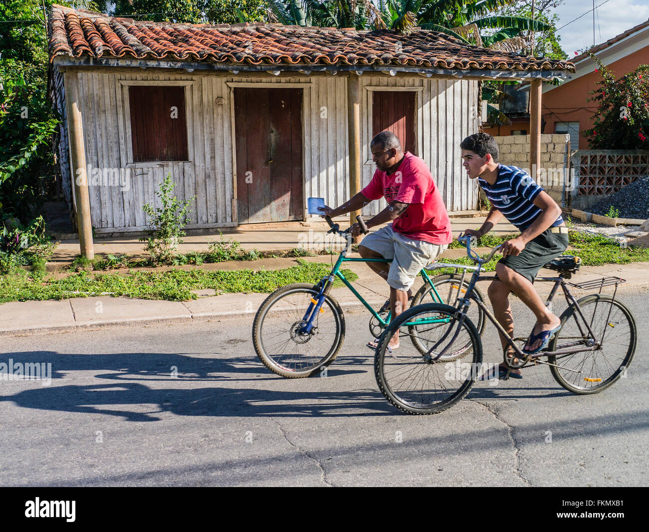 One bicycle two riders hi-res stock photography and images - Alamy