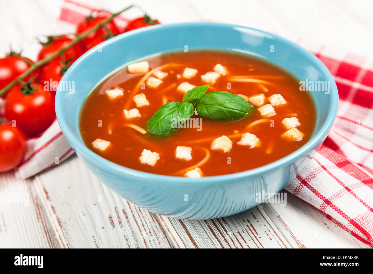 Tomato soup and basil Stock Photo - Alamy