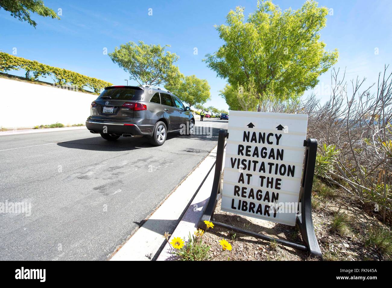 Simi Valley, California, USA. 09th Mar, 2016. People drive to the parking lot where they will board buses to the Ronald Reagan Presidential Library to pay their respects to former First Lady, Nancy Reagan, as she lies in repose. Mrs. Reagan died on March 6 of congestive heart failure at her home in Bel Air, California. She will be buried next to her husband, President Ronald Wilson Reagan, in a private ceremony at the Reagan Library on March 11. Credit:  Brian Cahn/ZUMA Wire/Alamy Live News Stock Photo