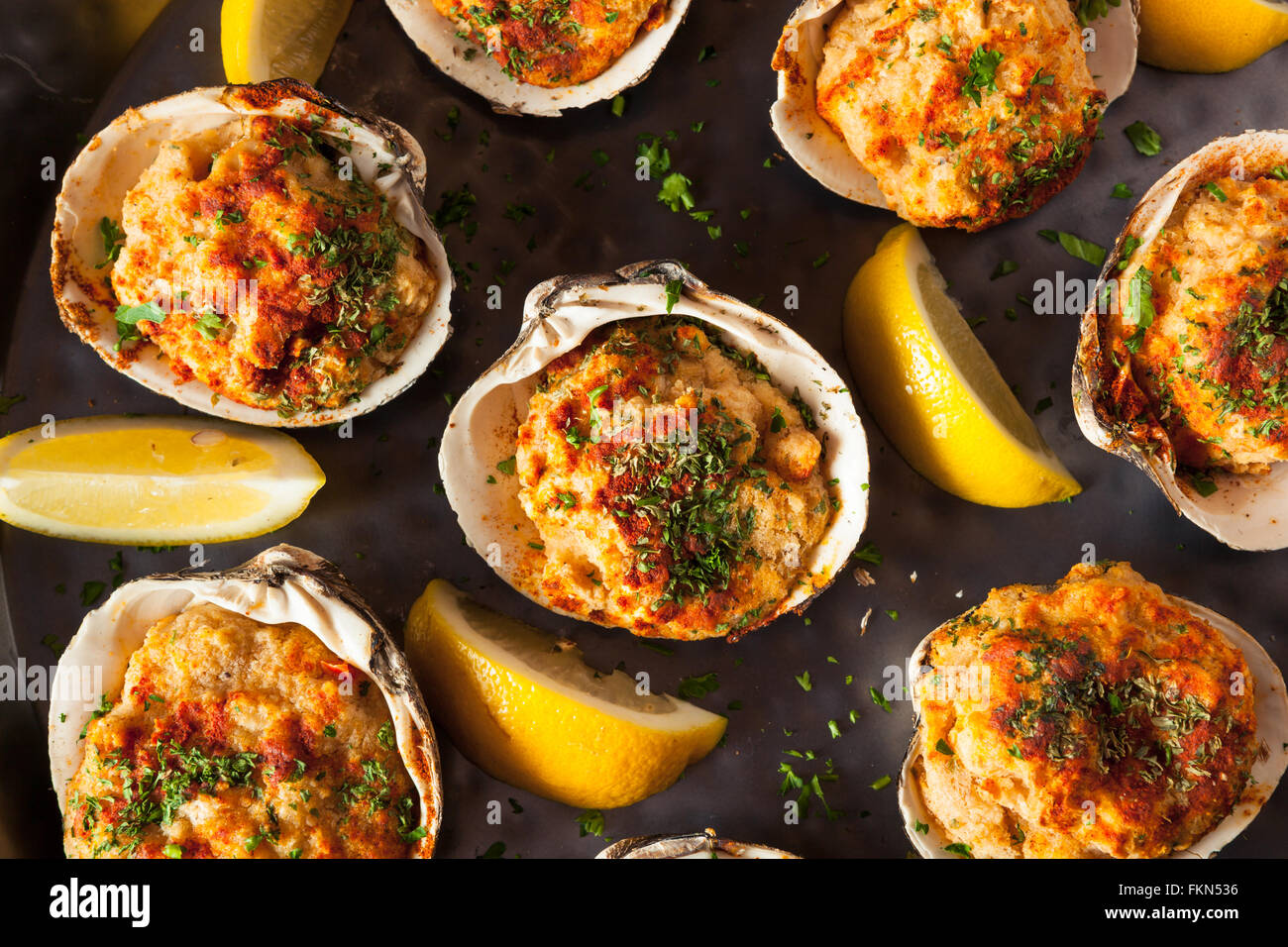 Homemade Baked Clams with Lemon and Parsley Stock Photo