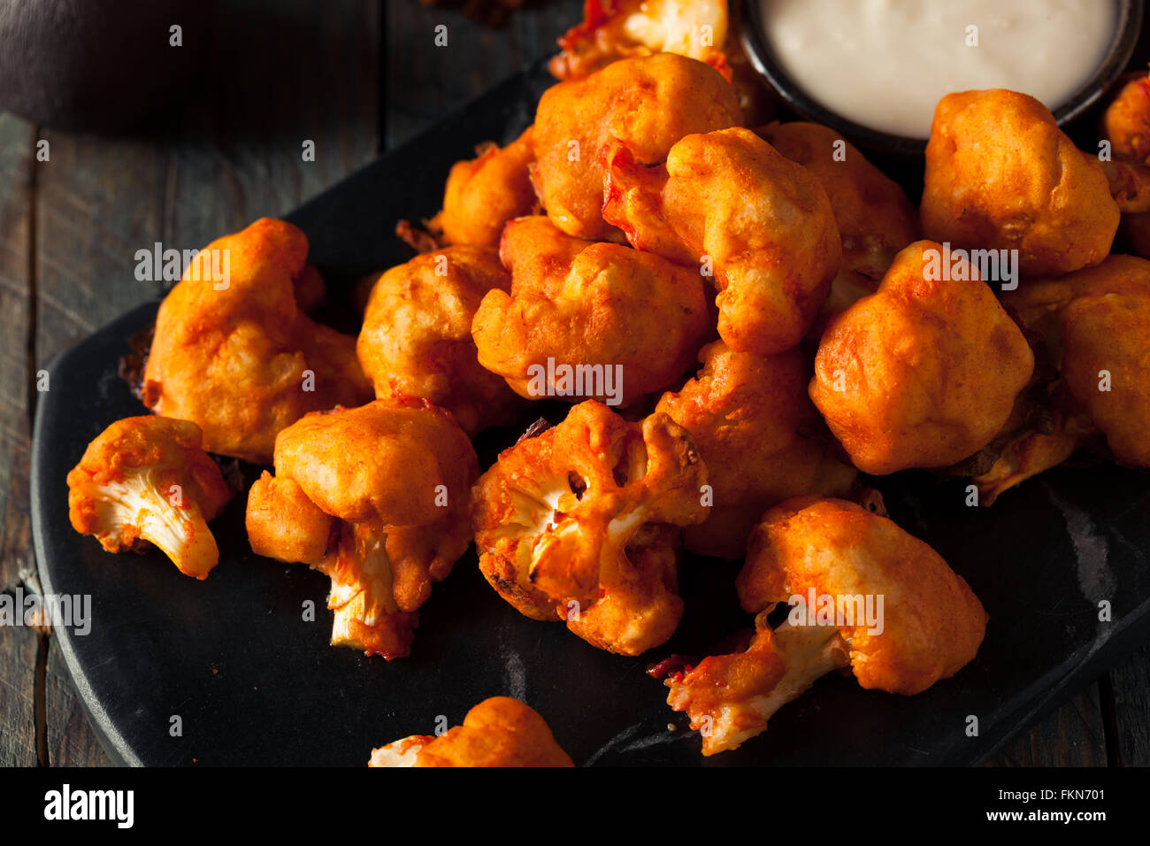 Spicy Breaded Buffalo Chicken Cauliflower with Blue Cheese Sauce Stock