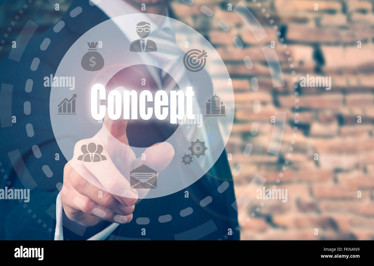 Businessman pressing a concept button. Stock Photo