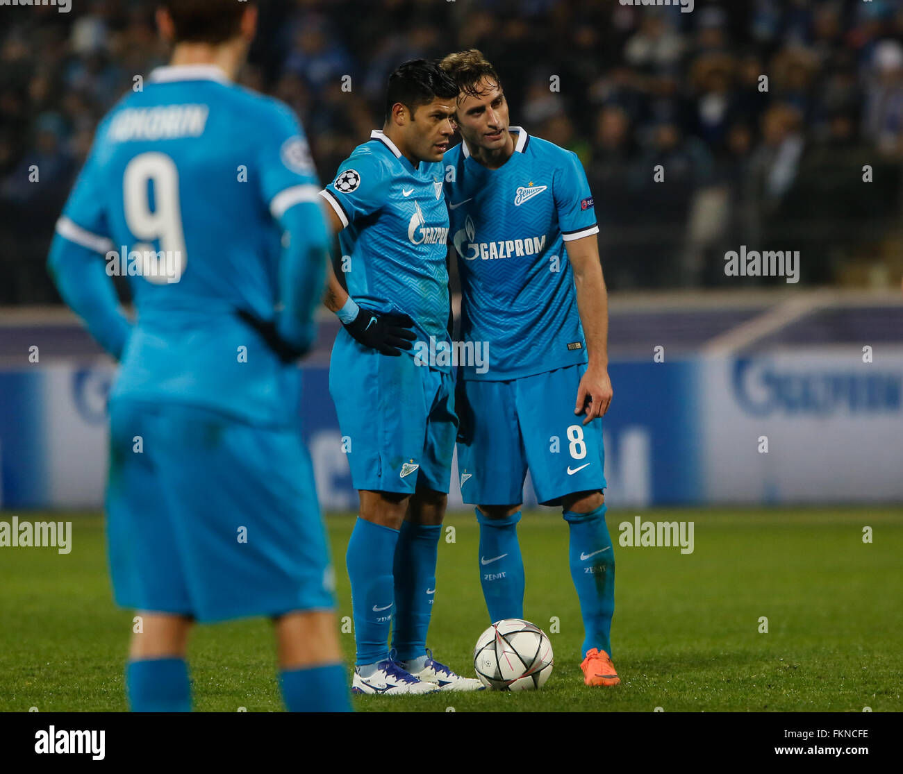 St. Petersburg, Russia. 9th March, 2016. Hulk (C) and Mauricio (R) of Zenit talk during the UEFA Champions League Round of 16 second leg match between FC Zenit St. Petersburg and SL Benfica at Petrovsky stadium. Credit:  Mike Kireev/Alamy Live News Stock Photo
