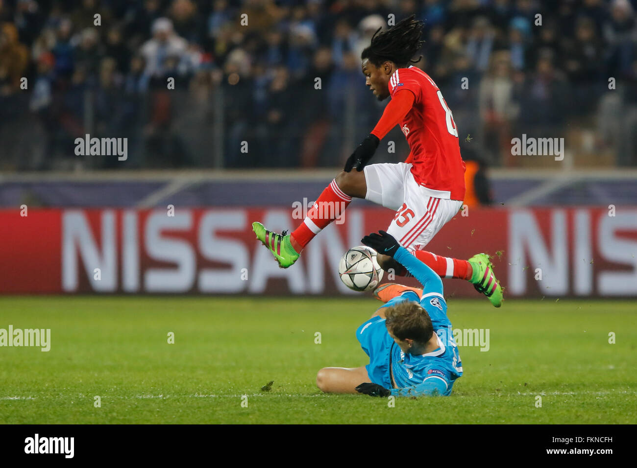 St. Petersburg, Russia. 9th March, 2016. Renato Sanches (top) of Benfica vies for the ball with Aleksandr Kokorin of Zenit during the UEFA Champions League Round of 16 second leg match between FC Zenit St. Petersburg and SL Benfica at Petrovsky stadium. Credit:  Mike Kireev/Alamy Live News Stock Photo
