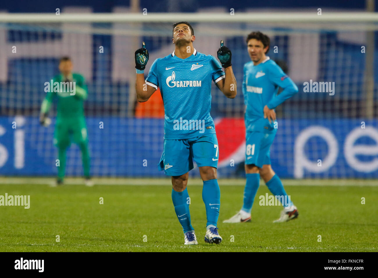 St. Petersburg, Russia. 9th March, 2016. Hulk (C) and Yuri Zhirkov (R) celebrate a goal during the UEFA Champions League Round of 16 second leg match between FC Zenit St. Petersburg and SL Benfica at Petrovsky stadium. Credit:  Mike Kireev/Alamy Live News Stock Photo