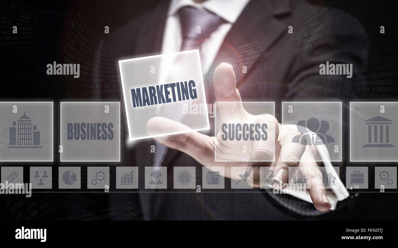 Businessman pressing a Marketing concept button. Stock Photo