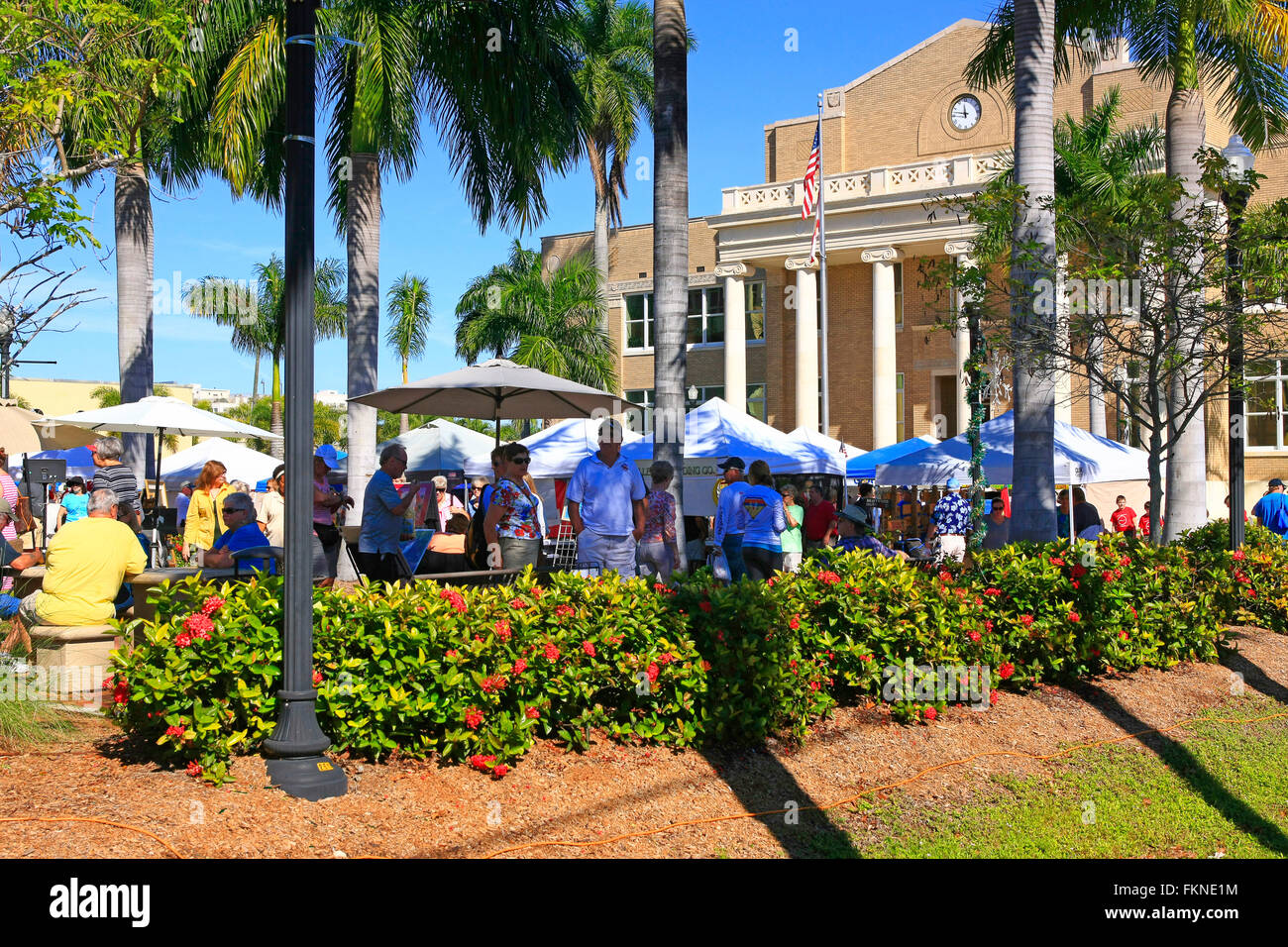 People at the Punta Gorda farmers market on a sunny January Saturday in