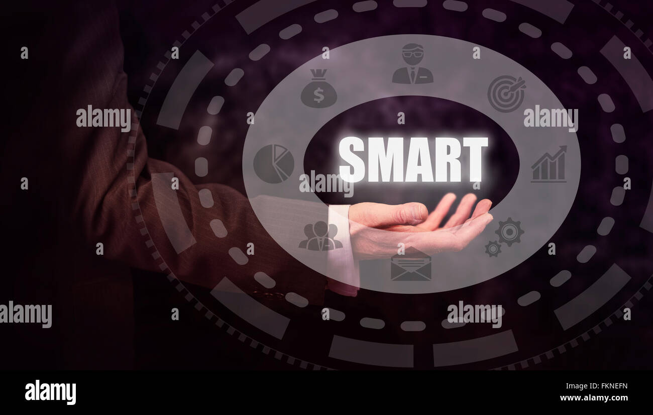 Businessman pressing a smart acronym concept button stock photo alamy