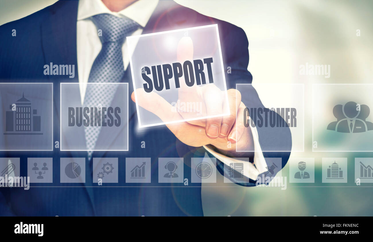 Businessman pressing an Support concept button. Stock Photo