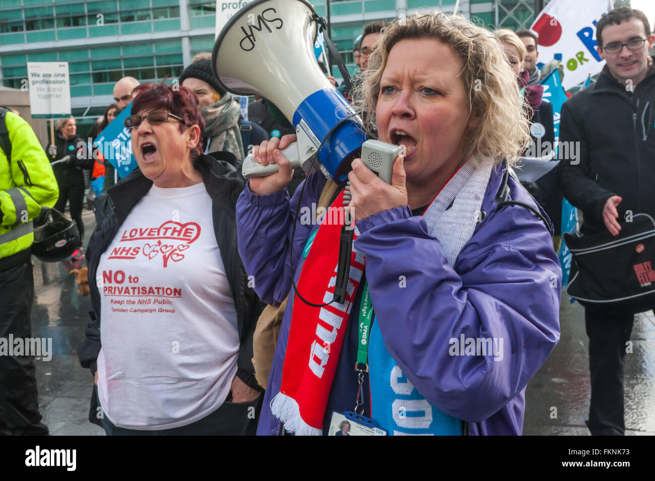 London, UK. 9th March, 2016. Trade unionists and others at a rally with NHS workers outside University College Hospital, joining the Junior Doctors picket line on their strike day. Janet Maiden leads the campaigners across the road for the rally. Peter Marshall/Alamy Live News Stock Photo