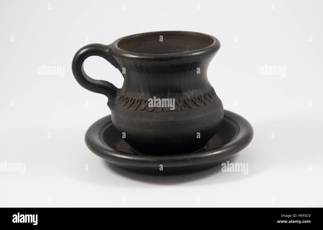 old clay cup and saucer on a white background Stock Photo Alamy