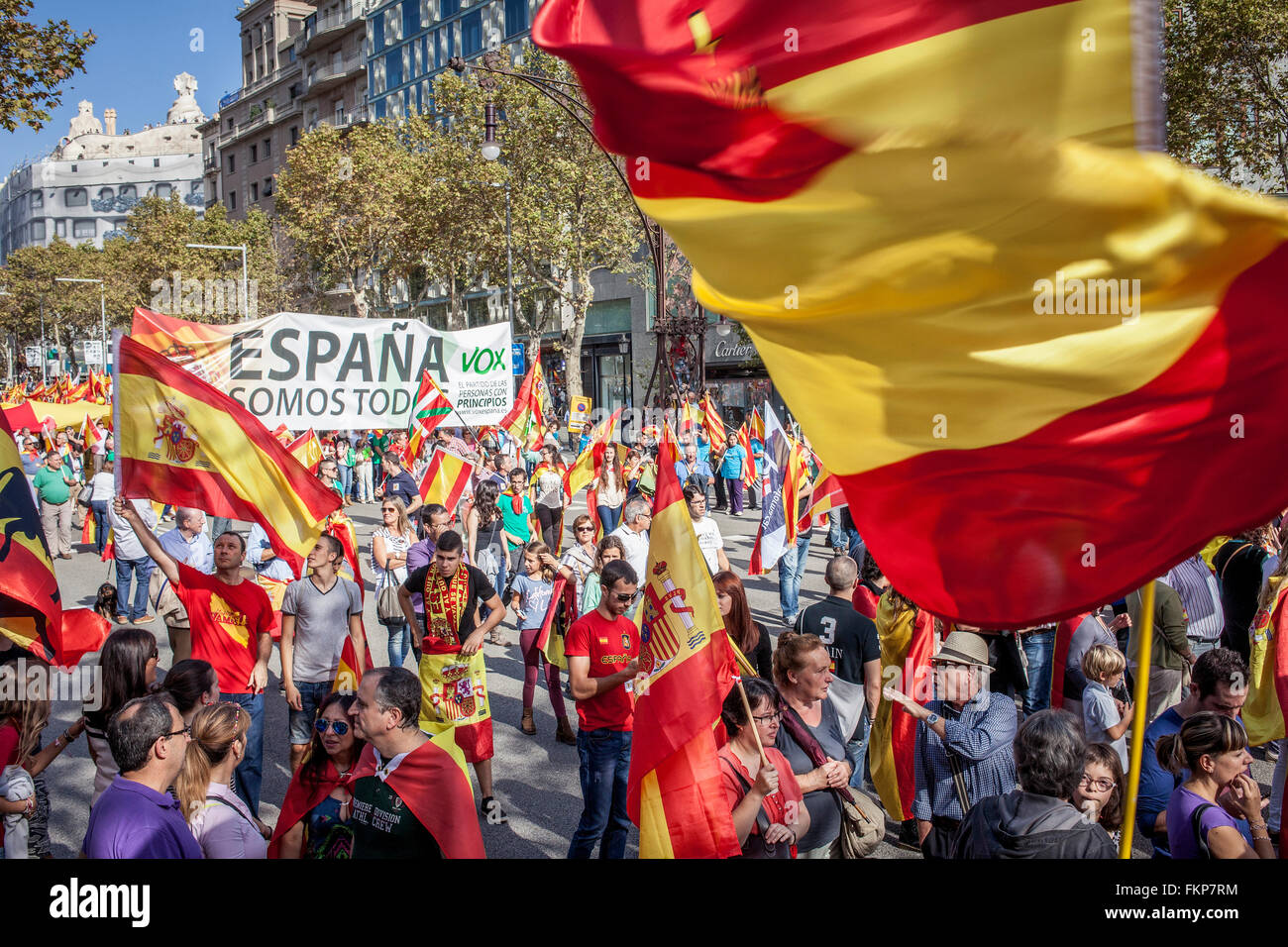 Anti-independence Catalan protestors carry Spanish and catalan flag during  a demonstration for the unity of Spain on the occasion of the Spanish Natio  Stock Photo - Alamy