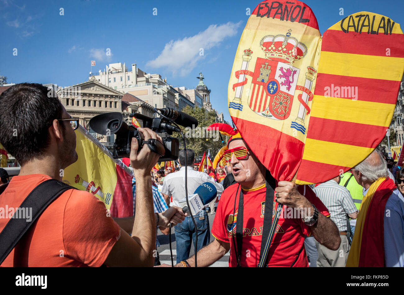 Anti-independence Catalan protestor carry Spanish and catalan flag during a demonstration for the unity of Spain on the occasion Stock Photo
