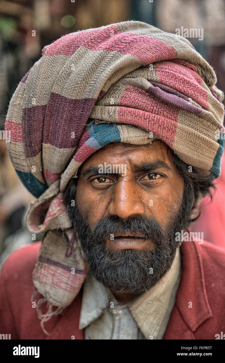 Indian local people pose for camera in the street of Old Delhi, India. Stock Photo