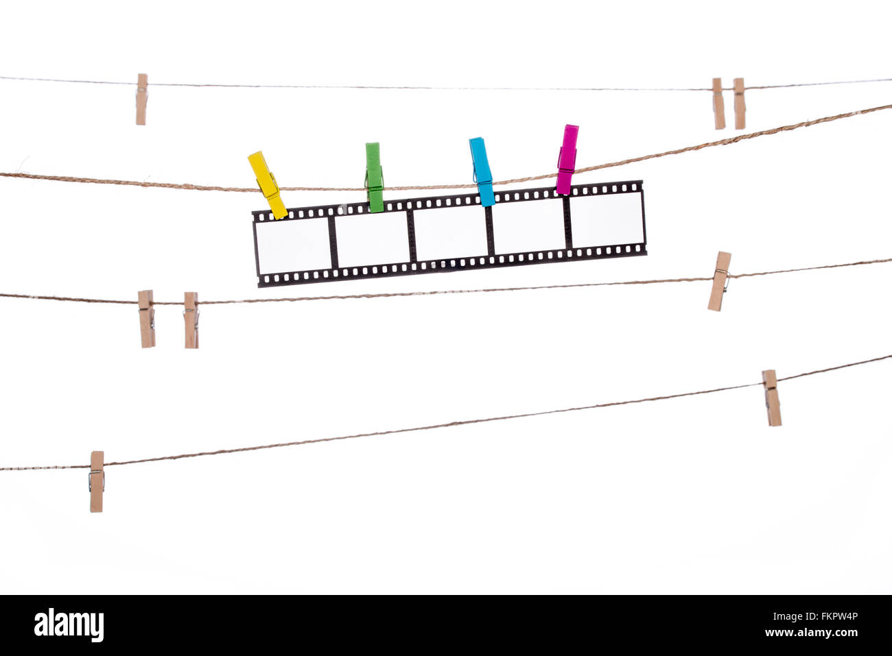Colorful Clothespins On A Clothesline Hanging Photographic Negatives
