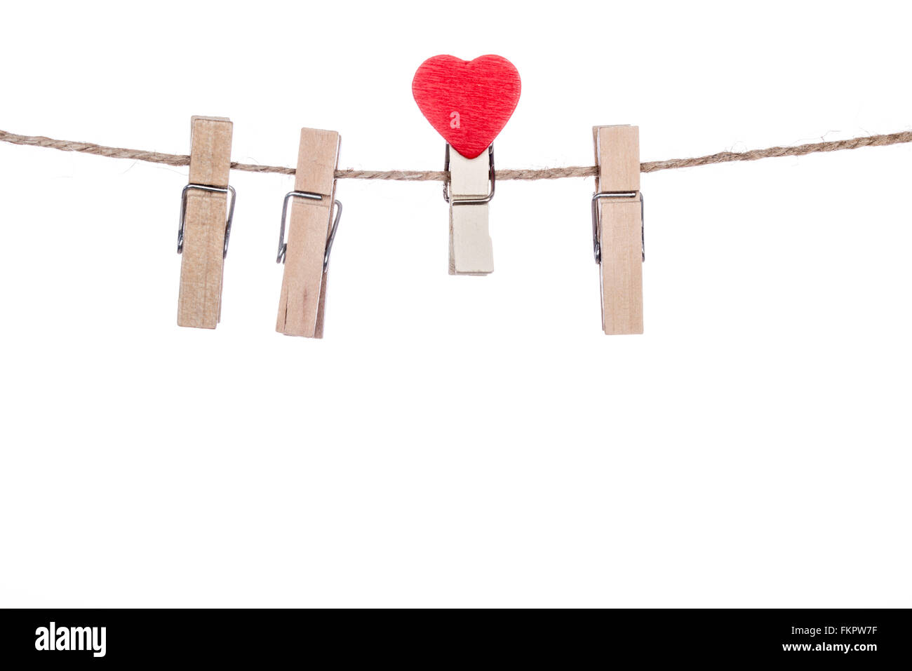 clothespins with heart  shape  clip on a clothesline, valentine romantic Stock Photo