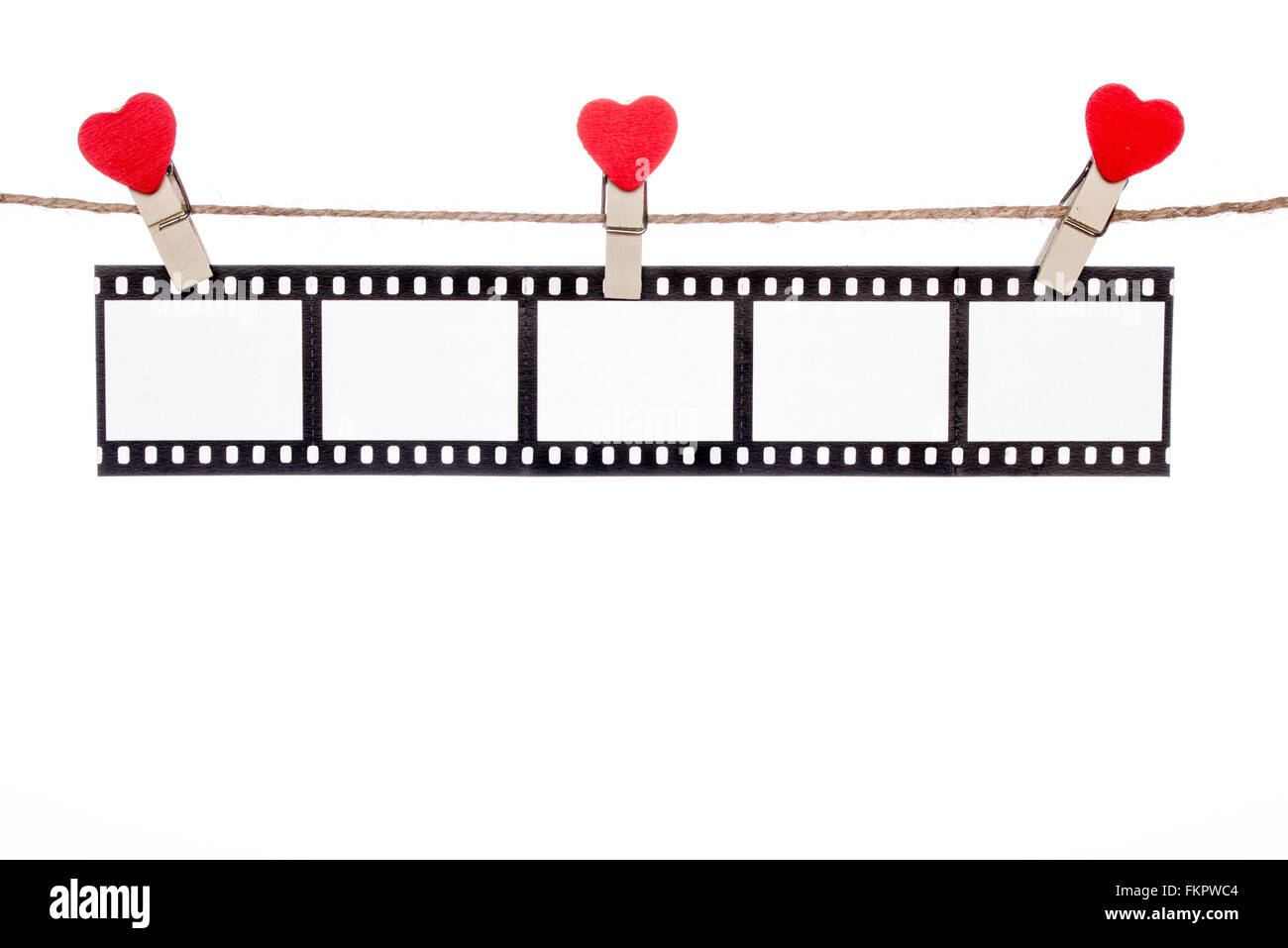 heart  shape clip on a clothesline , hanging Negatives, love movie memory Stock Photo