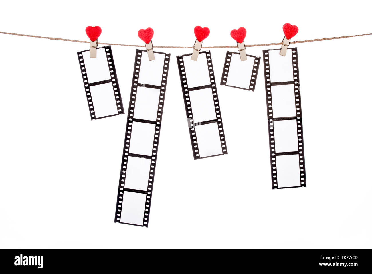 heart  shape clip on a clothesline , hanging Negatives, love movie memory Stock Photo