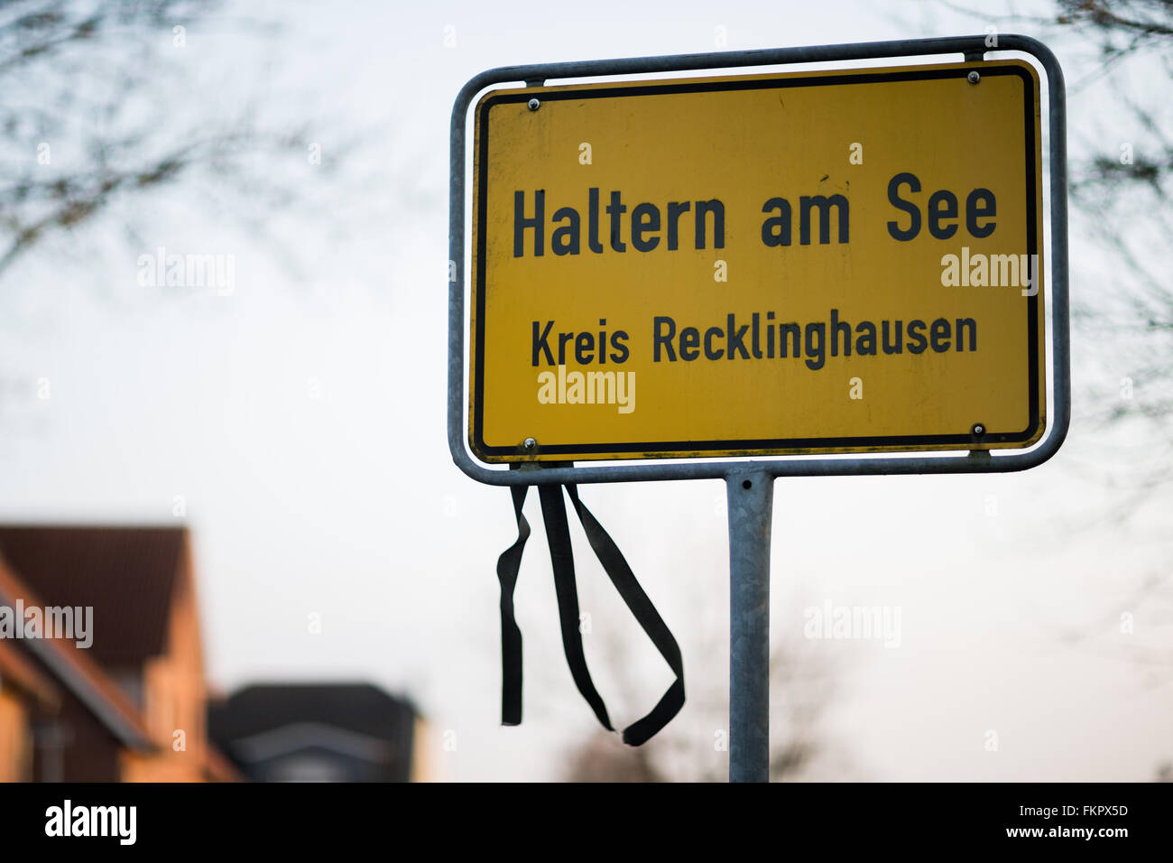 A black ribbon sways in the wind attached to a road sign which reads 'Haltern am See - County Recklinghausen' in Haltern am See, Germany, 29 February 2016. The airplane crash of Germanwings Flight 4U 9525 has changed the town of Haltern. A memorial site for the victims of Germanwings Flight 4U 9525 was errected on the local cemetery. Photo: Rolf Vennenbernd/dpa Stock Photo