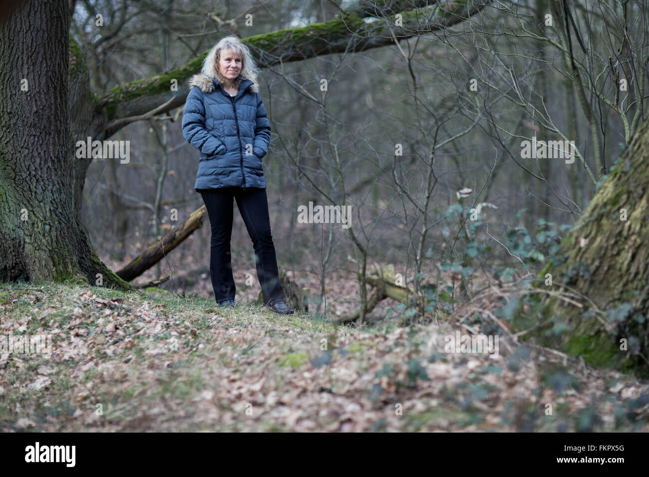 The chairwoman of the Elena Bless Foundation, Annette Bless, stands in a forest near Haltern am See, Germany, 3 March 2016. Annette Bless lost her daughter Elena who was a passenger onboard the crashed Germanwings Flight 4U 9525. Photo: Rolf Vennenbernd/dpa Stock Photo