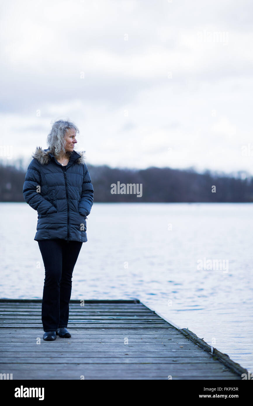 The chairwoman of the Elena Bless Foundation, Annette Bless, stands beside a lake in Haltern am See, Germany, 3 March 2016. Annette Bless lost her daughter Elena who was a passenger onboard the crashed Germanwings Flight 4U 9525. Photo: Rolf Vennenbernd/dpa Stock Photo