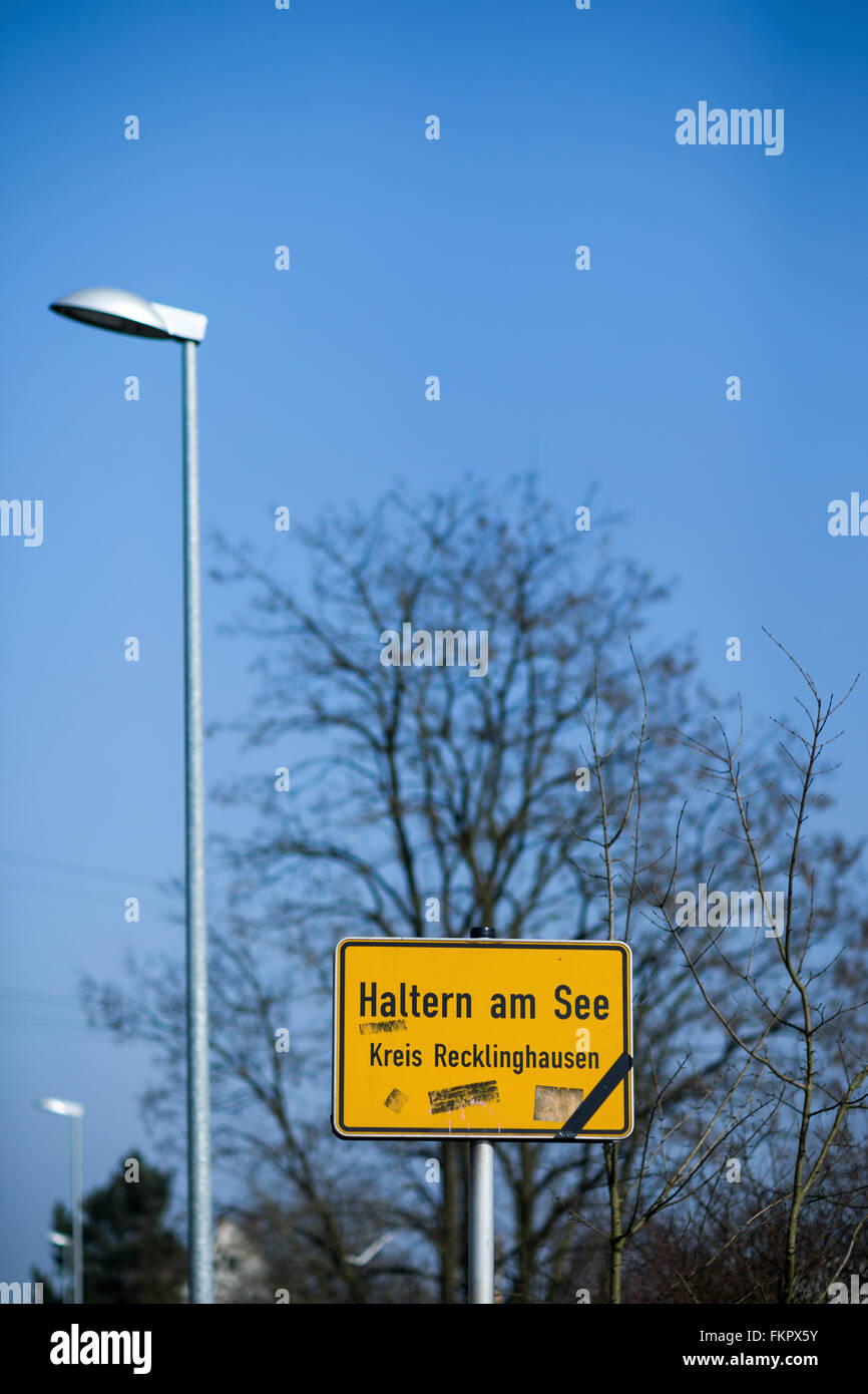 A black ribbon hangs attached to a road sign which reads 'Haltern am See - County Recklinghausen' in Haltern am See, Germany, 29 February 2016. The airplane crash of Germanwings Flight 4U 9525 has changed the town of Haltern. A memorial site for the victims of Germanwings Flight 4U 9525 was errected on the local cemetery. Photo: Rolf Vennenbernd/dpa Stock Photo