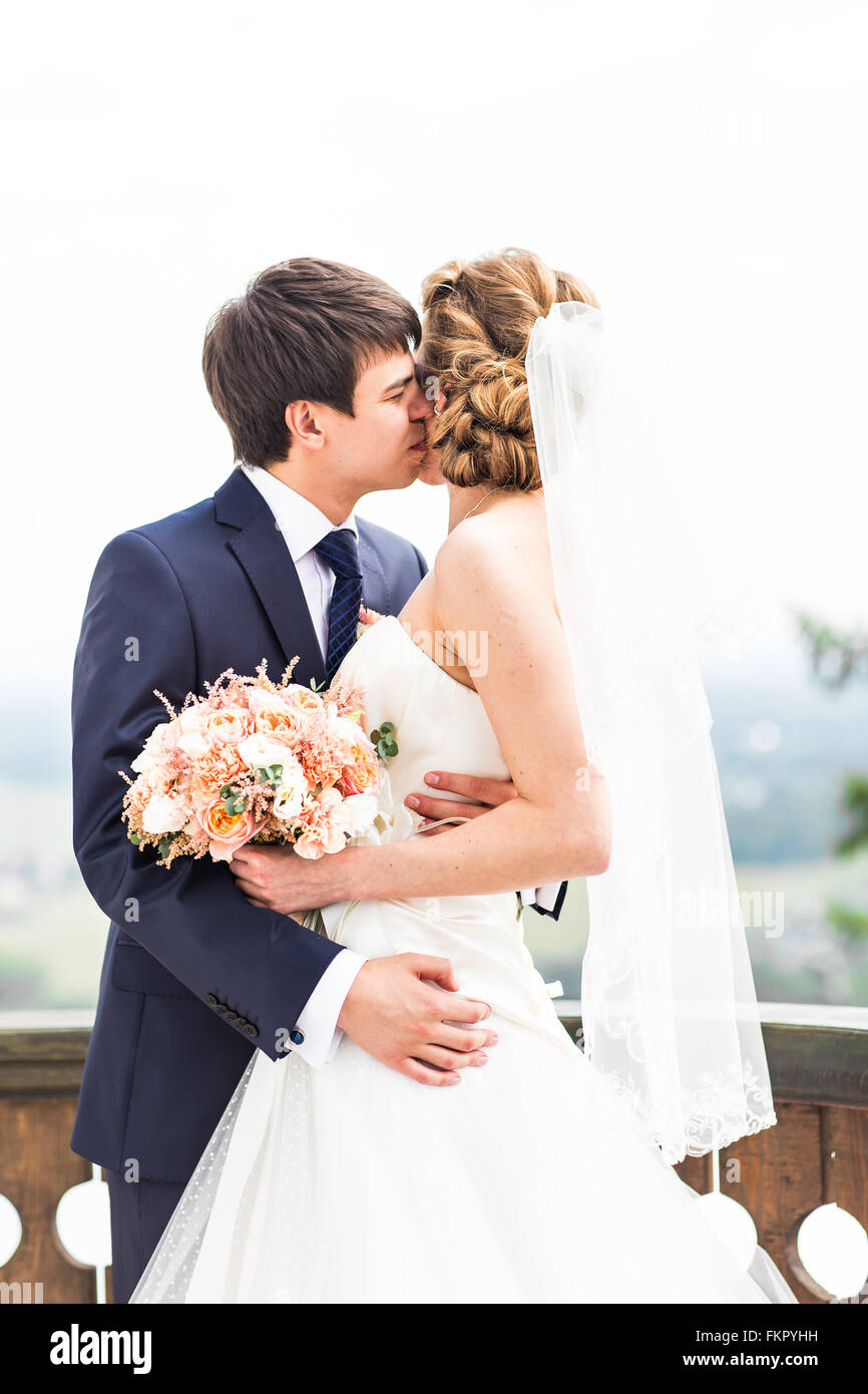 Wedding, Beautiful Romantic Bride and Groom Kissing Stock Photo - Alamy
