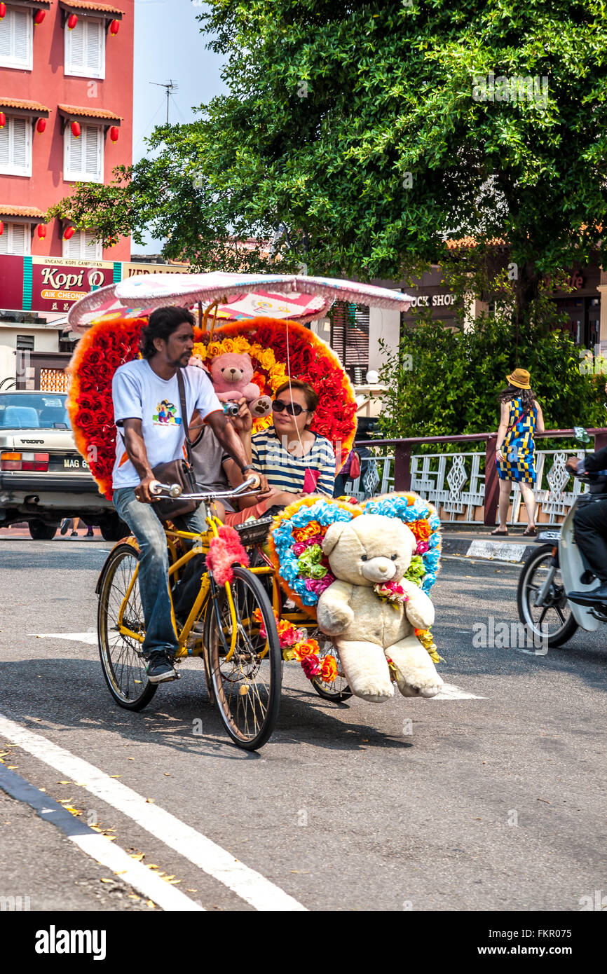 Malaysia Malacca also spelt Melaka Heavily decorated local trishaws  Adrian Baker Stock Photo