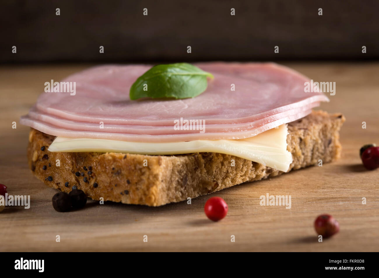 Open sandwich with cheese, salami and basil Stock Photo Alamy