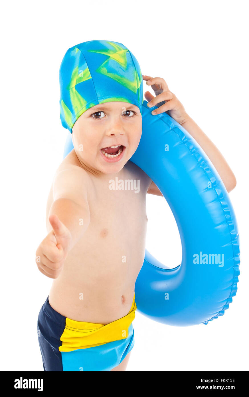 Funny little boy playing with blue life ring in swim cap, isolated in