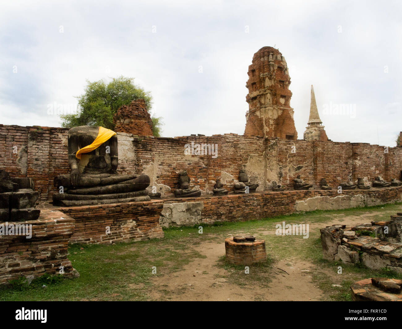 Temple buddha statue and ruins Wat Mahathat Ayutthaya Thailand Stock Photo