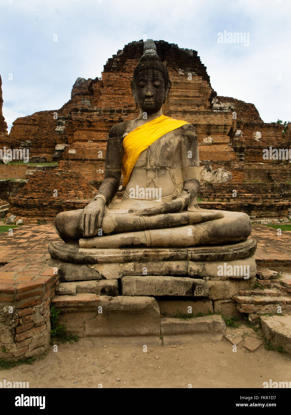 Temple buddha statue and ruins Wat Mahathat Ayutthaya Thailand Stock Photo