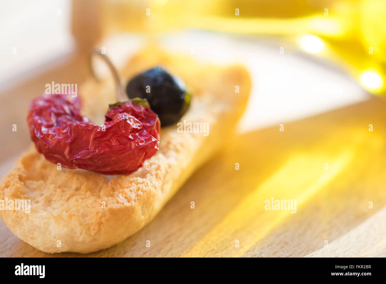 appetiser of toast hot pepper and black olive Stock Photo