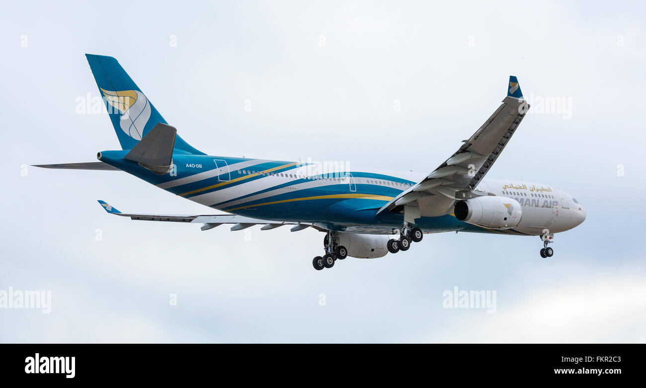 Oman Air Aeroplane landing at London Heathrow airport Stock Photo